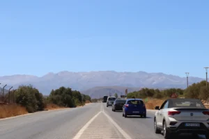 cars driving away from Chania Airport towards Chania city