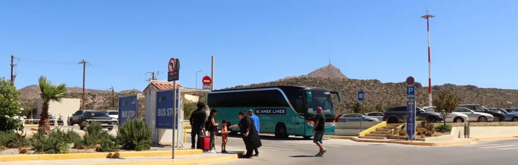 Passengers waiting for the KTEL bus at Chania Airport (CHQ), Crete — August 2025