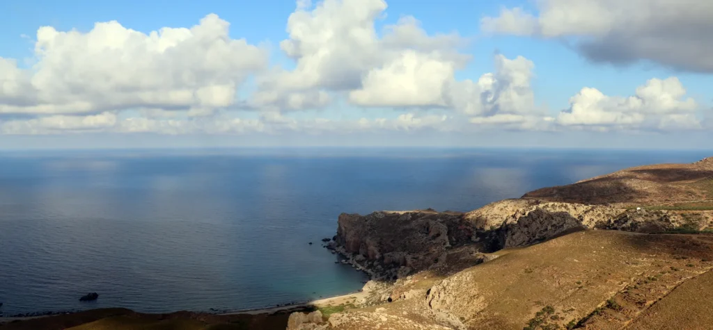 Agiofarago Beach in Crete with rocky cliffs and clear blue sea