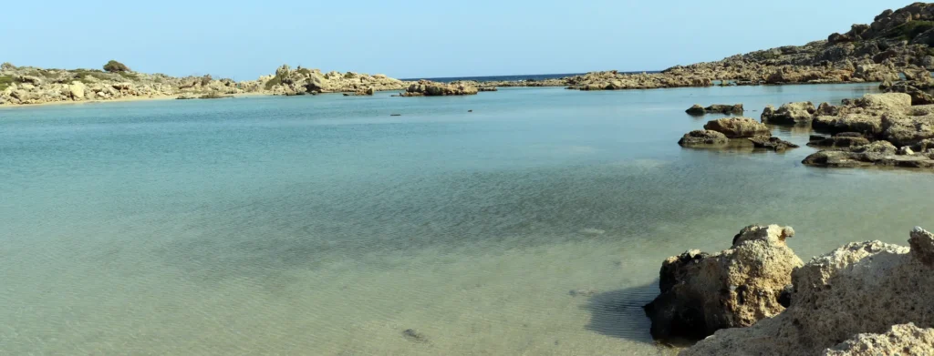 Agios Pavlos Beach in Crete with turquoise waters and rocky coastline