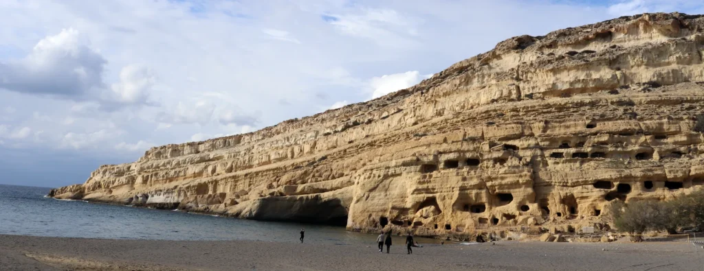 Panoramic view of Matala beach with famous caves in Crete, Greece