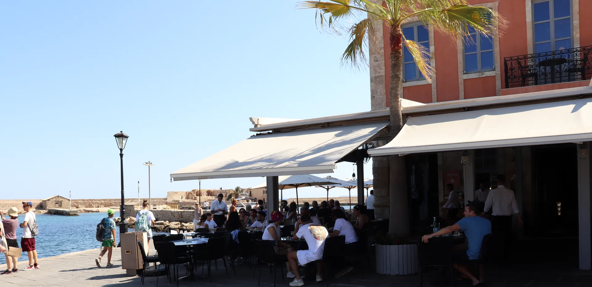 Waterfront terrace of Pallas Restaurant in Chania Old Harbor