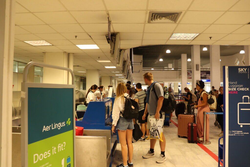 Passengers waiting at the check-in desks inside Heraklion Airport (HER), Crete