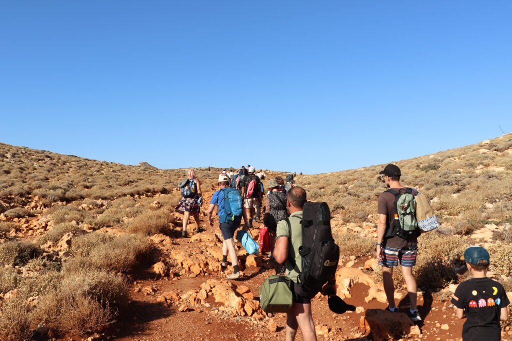 Hikers walking up trail from Balos Beach — Crete