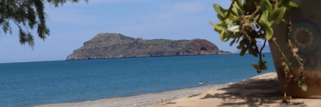 Agia Marina Beach, Chania — view from a seaside café towards the small island with
