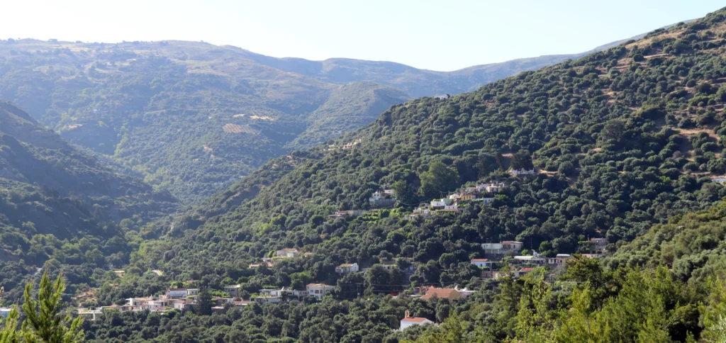 Small mountain village surrounded by green hills on the road to Sougia, Crete