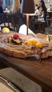Grilled pork steak served with vegetables at 6 Kamares restaurant in Chania