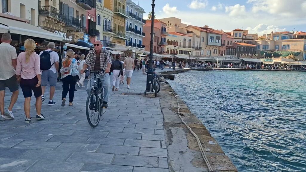 Chania Old Venetian Port promenade at sunset
