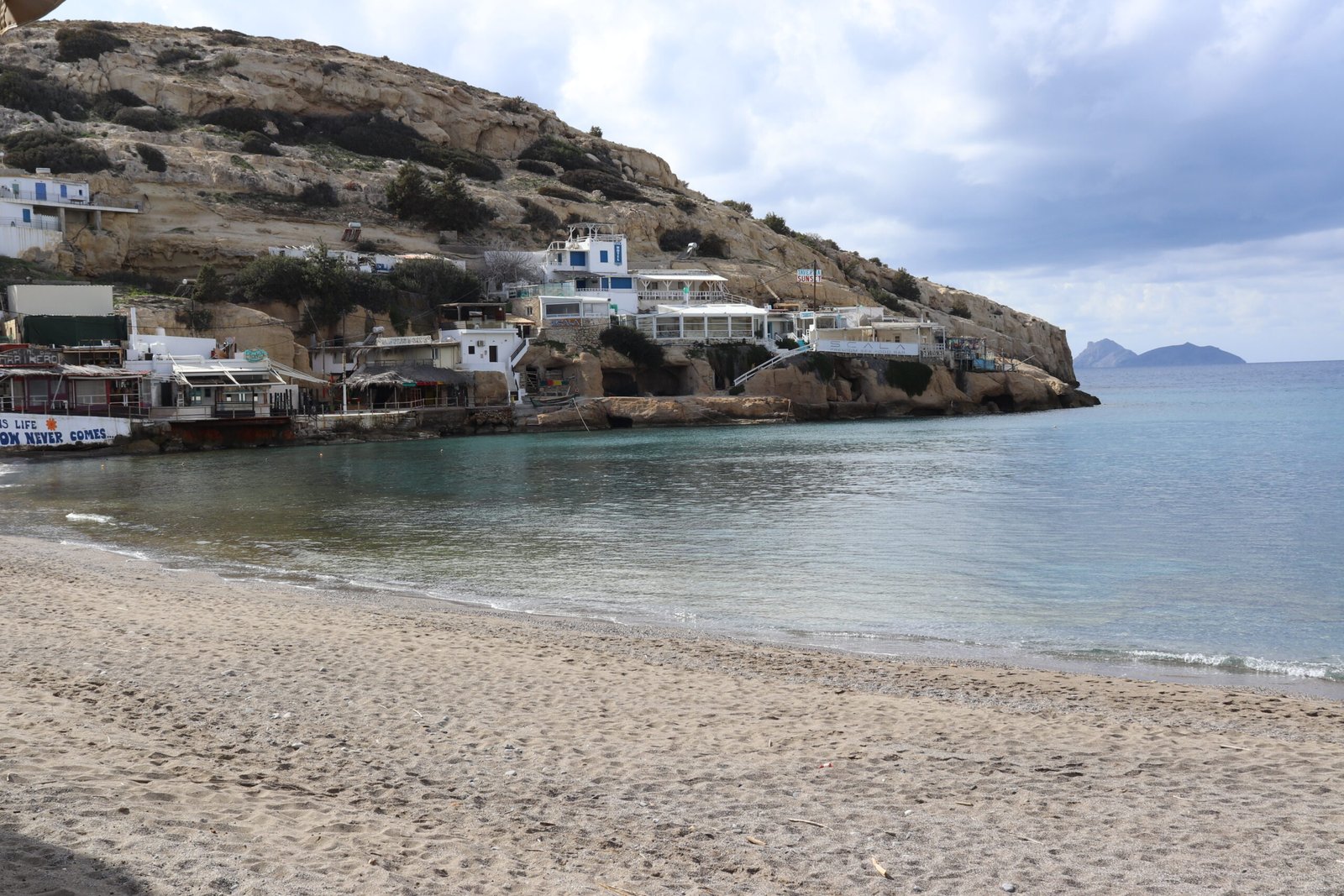Matala Beach cliffs and famous caves in southern Crete Matala caves carved into the cliff above the sandy beach in Crete