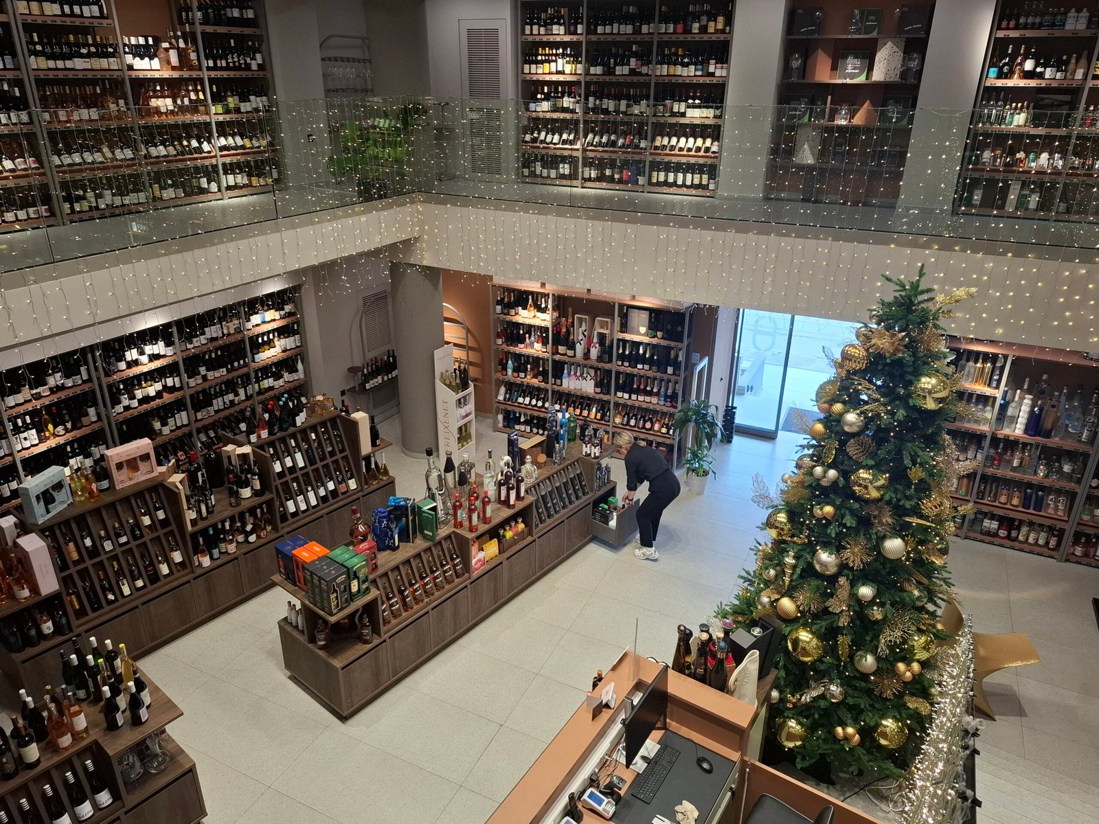 Two-level interior of Thimianos AE wine and spirits shop in Chania