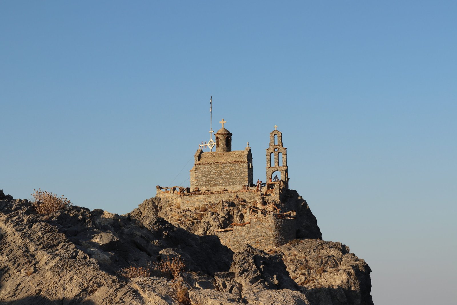 Stone-built Agios Paisios Chapel standing on the rocky hill above Ammoudi near Plakias, Crete.