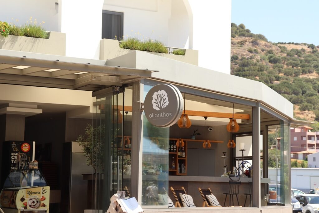 Alianthos seaside restaurant facade in Plakias, Crete, with bar and modern terrace.