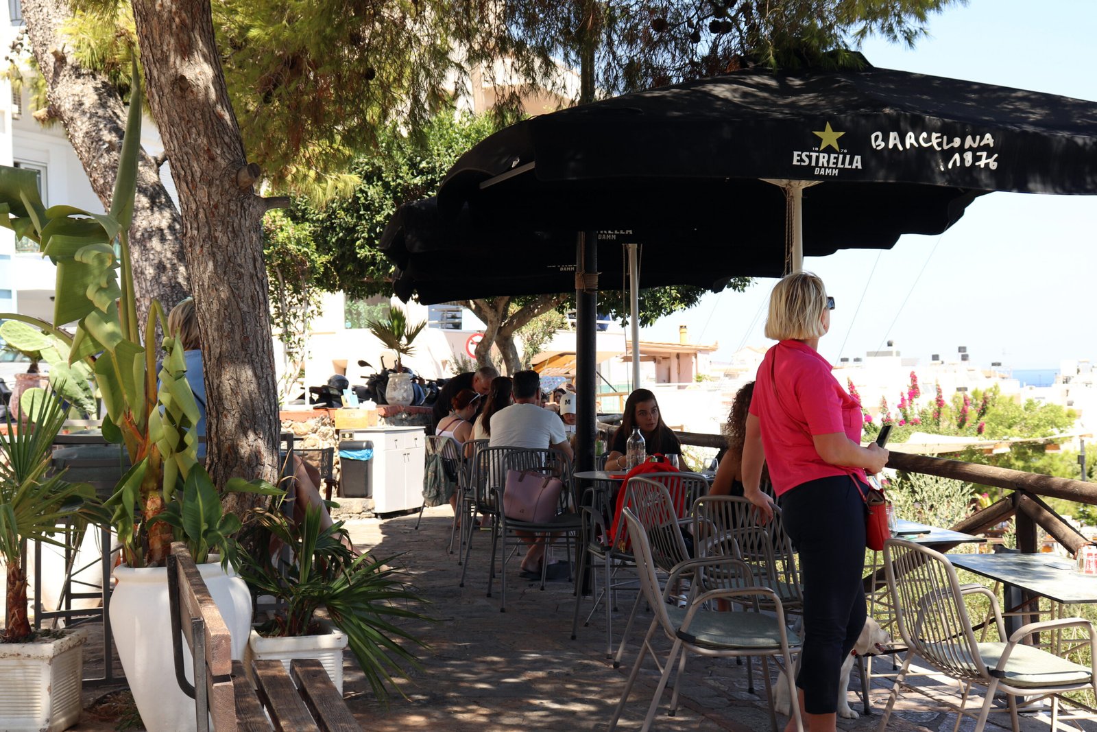 ARC Café Terrace — Agios Nikolaos ARC Café terrace in Agios Nikolaos with shaded seating and sea-view panorama — summer 2025, Crete