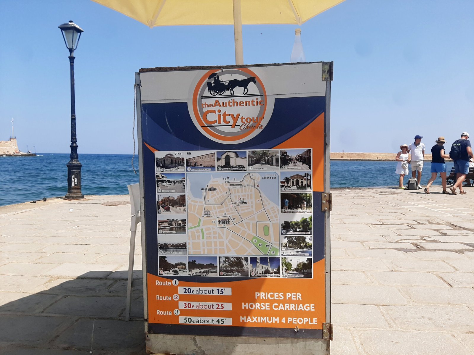 Chania horse carriage price board showing €20, €30 and €50 routes in 2025