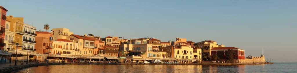 Panoramic view of the Old Venetian Harbor in Chania at sunset