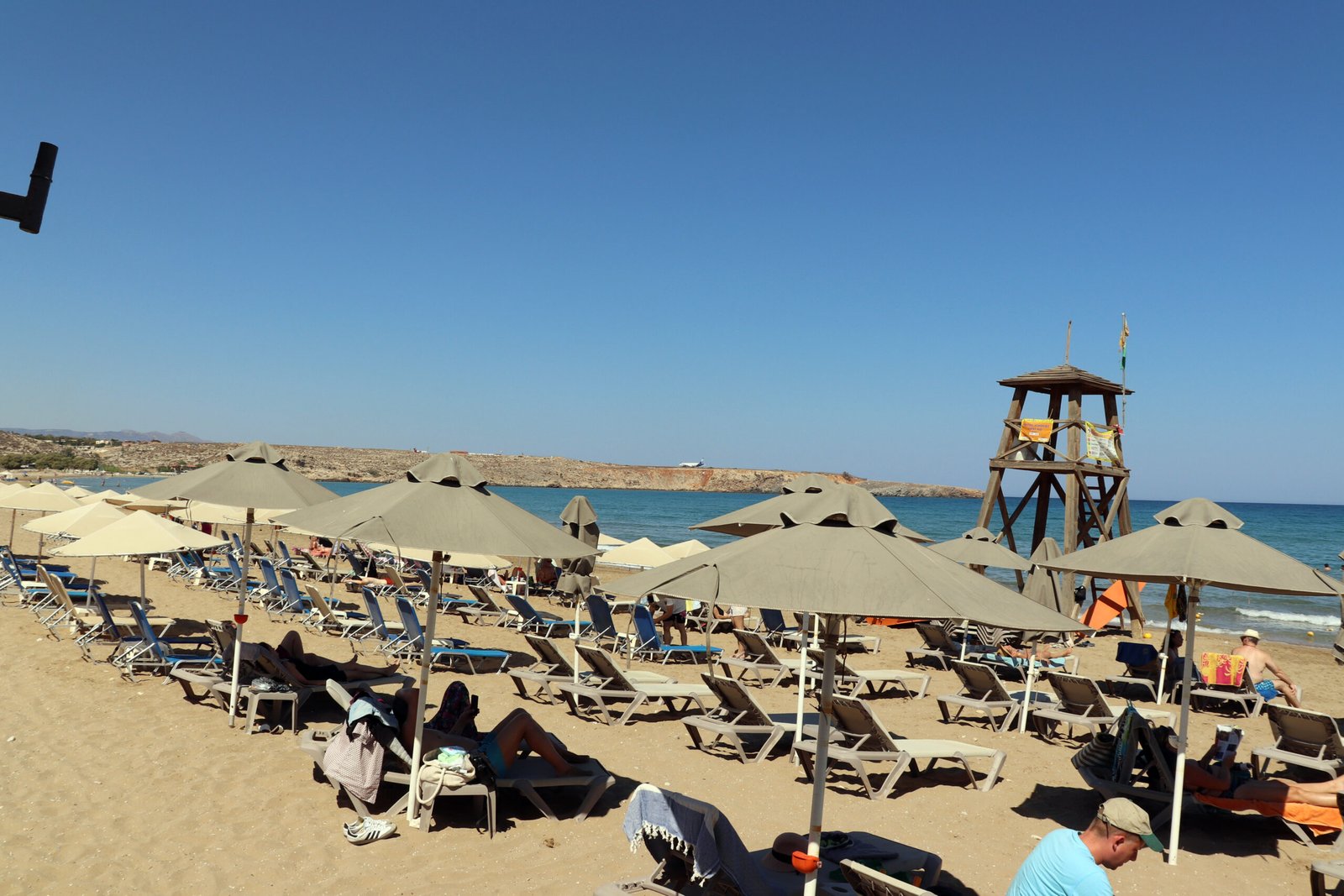 Organised Municipal Section of Karteros Beach Organised sunbeds, umbrellas and lifeguard tower on Karteros Beach in Crete