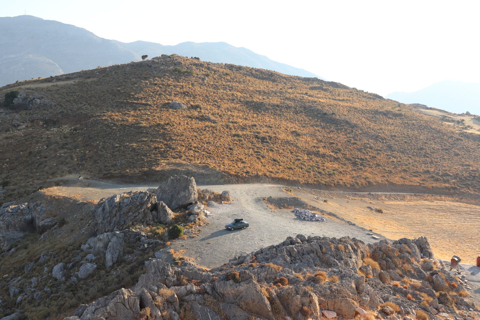 Zurab’s camper car parked above Ammoudi Beach on the rocky plateau in Plakias, Crete.