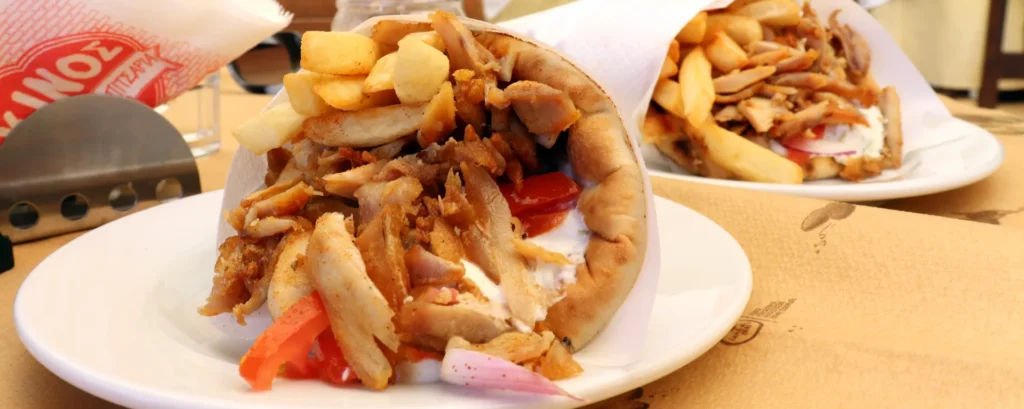 Fresh gyros pita with fries served at a street food shop in Rethymno