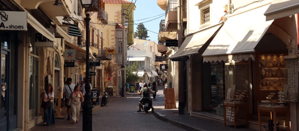 Pedestrian shopping street in Rethymno Old Town with cafés and local stores