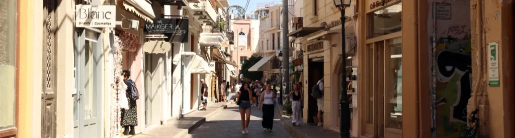 Narrow street near Rethymno Old Harbor with restaurants and local shops