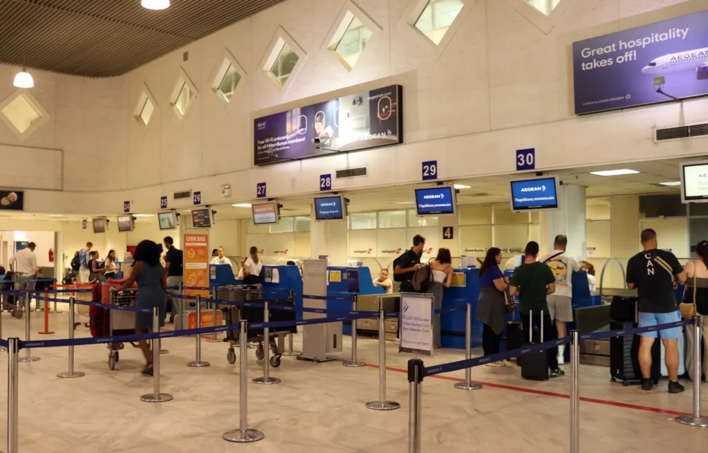 Heraklion Airport terminal check-in area with airline counters