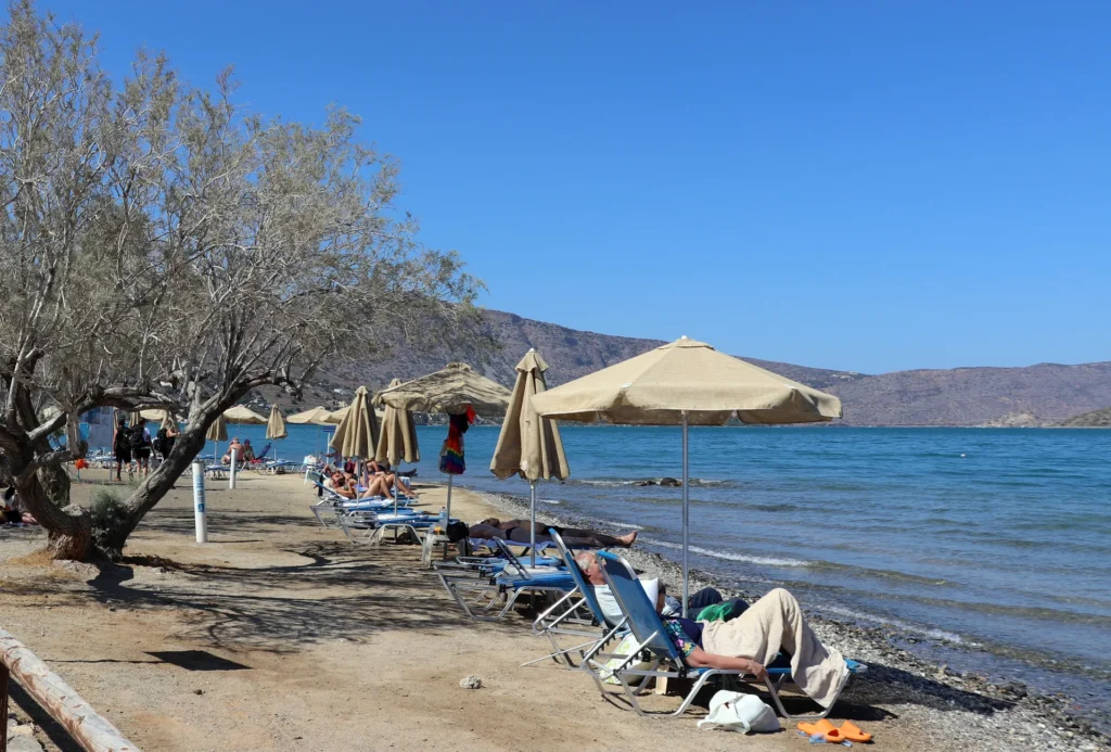 Calm beach in Elounda with sheltered bay and gentle sea conditions in Lasithi, Crete
