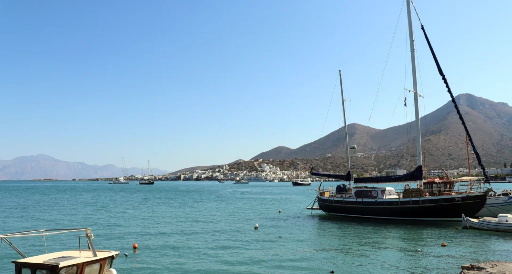 Boats moored at Elounda Marina, where visitors return after visiting Spinalonga