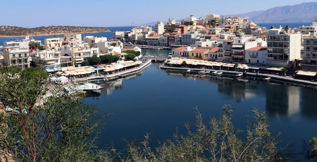 Panoramic view of Agios Nikolaos harbor and the coastline toward Elounda in Crete