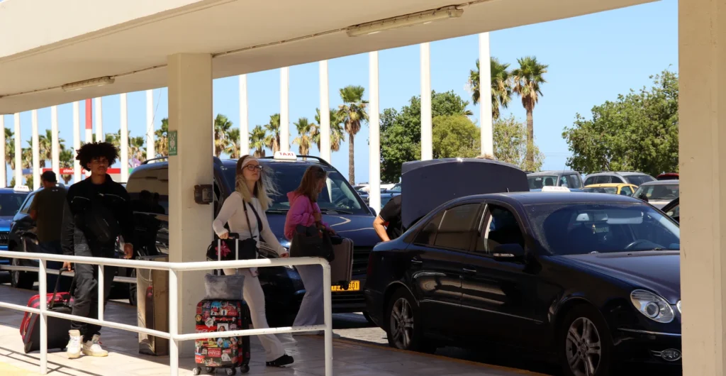 Passengers boarding a taxi outside Chania International Airport terminal