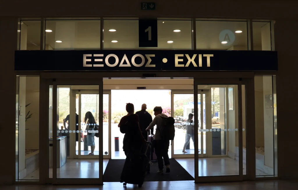 Passengers leaving the arrivals exit at Chania International Airport