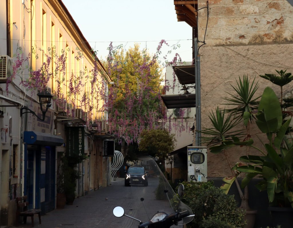 driving in Chania Old Town street at sunrise with car narrow road Crete