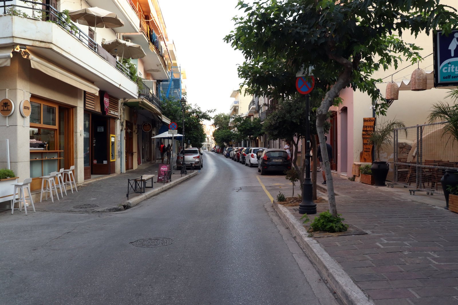 Driving in Chania Old Town narrow street taxi