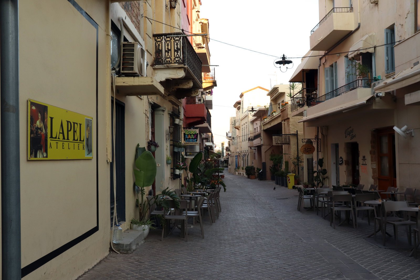 Driving in Chania Old Town narrow street taxi