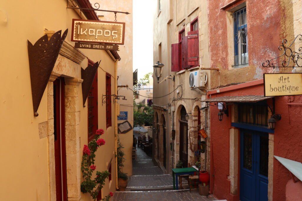 Narrow pedestrian street with warm evening light in Chania Old Town, Crete