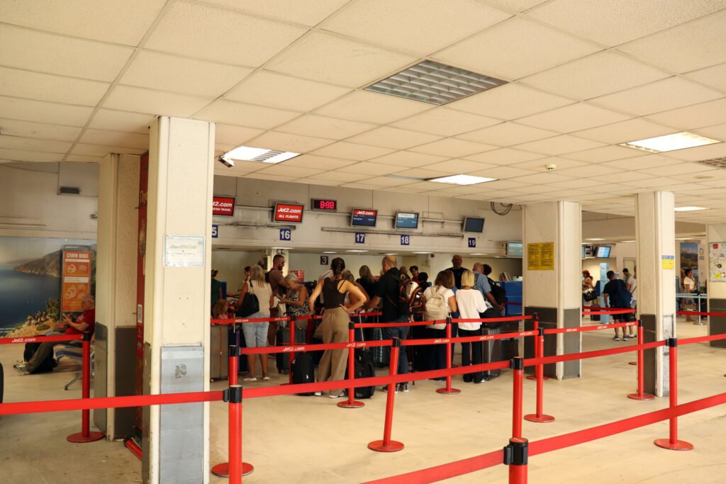 Passengers waiting near the security and check-in area at Heraklion Airport
