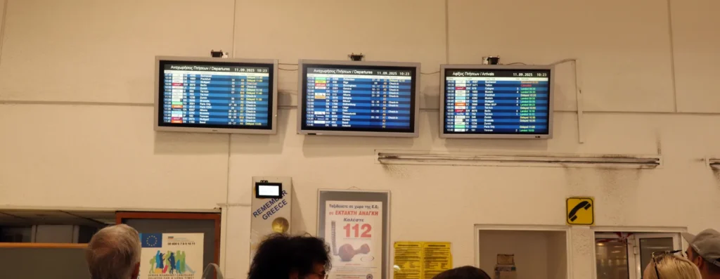 Departure information screens inside Heraklion Airport terminal