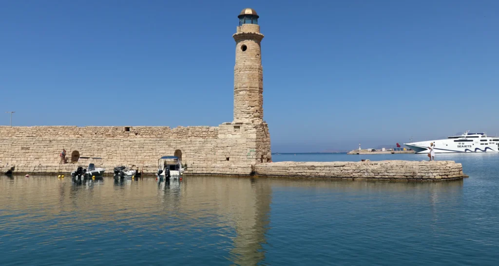 Rethymno lighthouse and Venetian Harbor in daylight