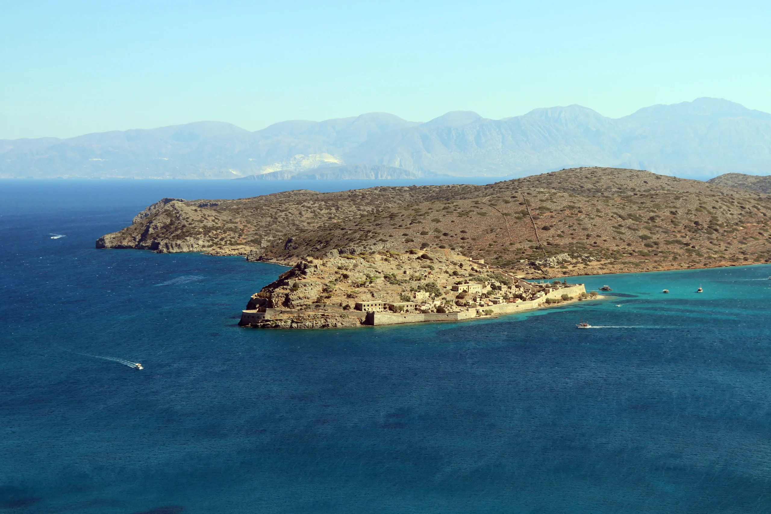 Spinalonga Island surrounded by the blue water of Mirabello Bay