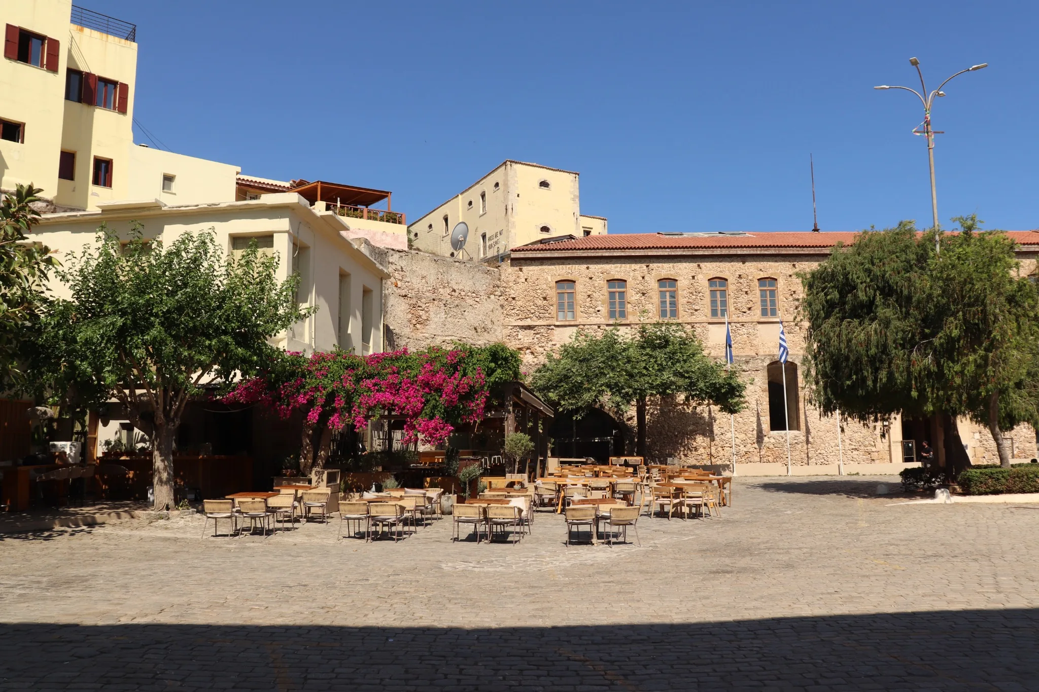 Square in Chania Old Town Outdoor cafe tables in a square in Chania Old Town