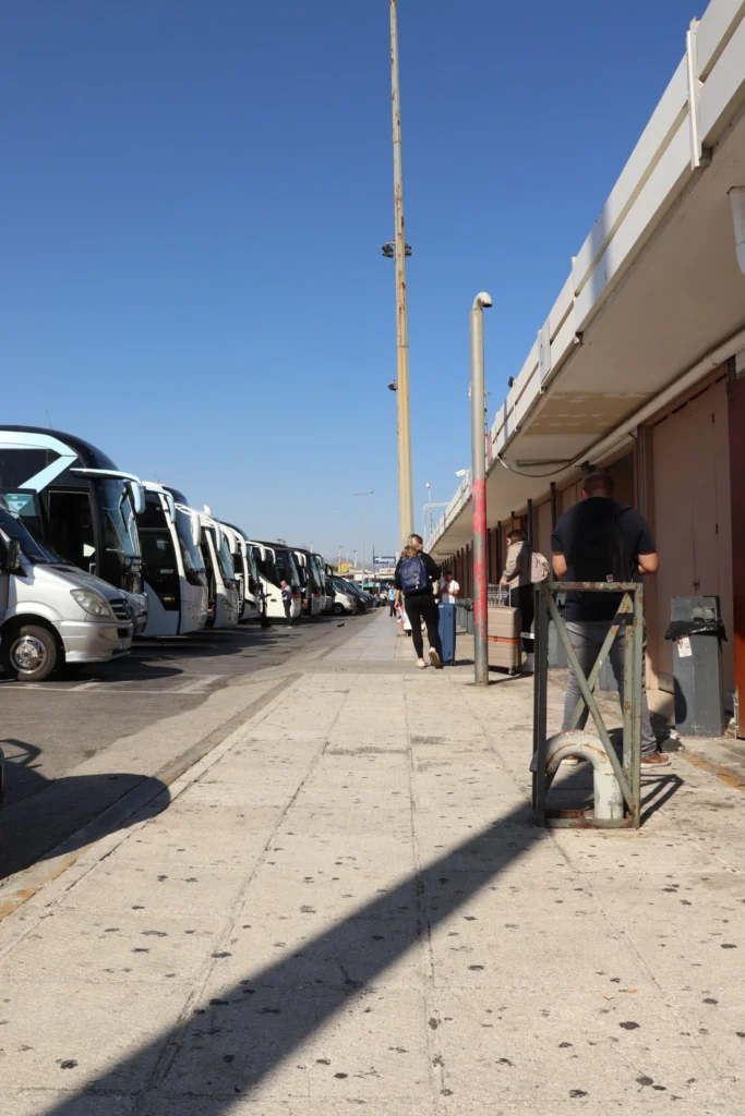 Buses and passengers at Heraklion Port in Crete